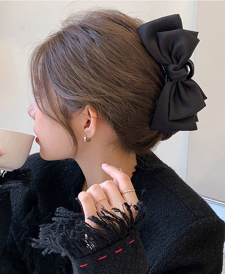 Double-sided bow grip clip